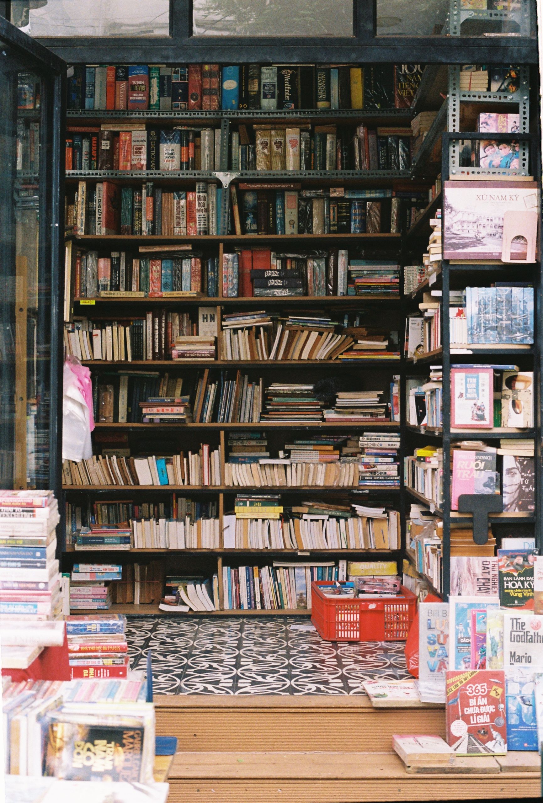 Explore a cozy vintage bookstore featuring an array of assorted books on shelves.